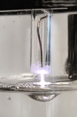Non-thermal plasma discharges over liquids. These discharges activate the liquid through chemical reactions initiated by reactive oxygen species that cause the formation of antimicrobial compounds such as hydrogen peroxide.